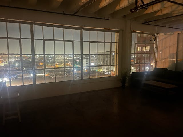 Open Loft Space with Broad Windows 11